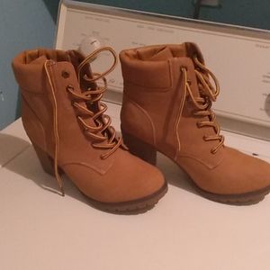 I am selling wedge heeled boots.